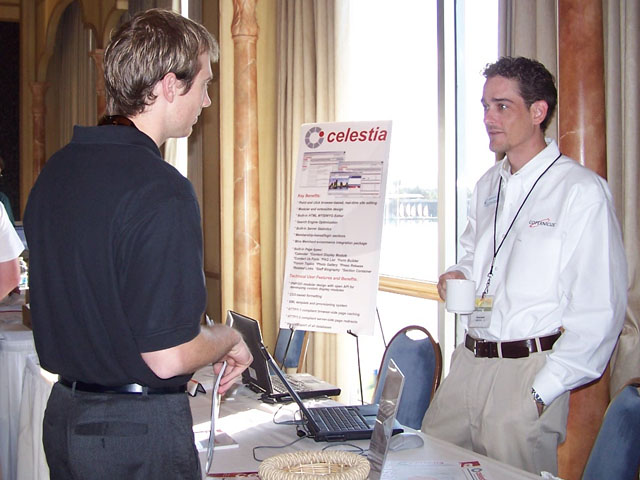 Scott from Sebenza talking with James at the Copernicus table.